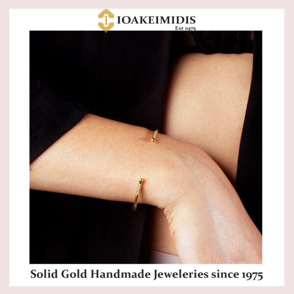 Golden cuff bracelet with diamonds