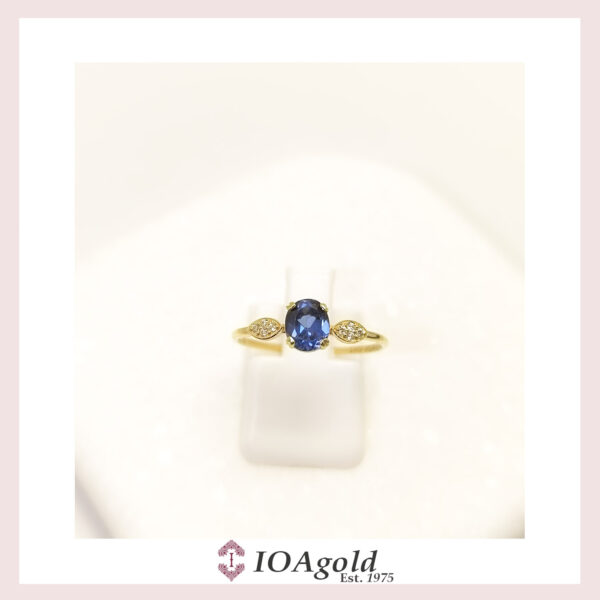 Gold ring 14k Oval Blue center with side white stones