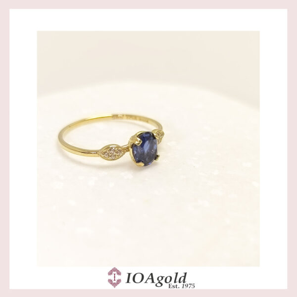 Gold ring 14k Oval Blue center with side white stones