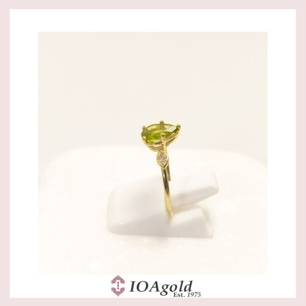 Gold ring 14k Peridot center and  zirconia stones