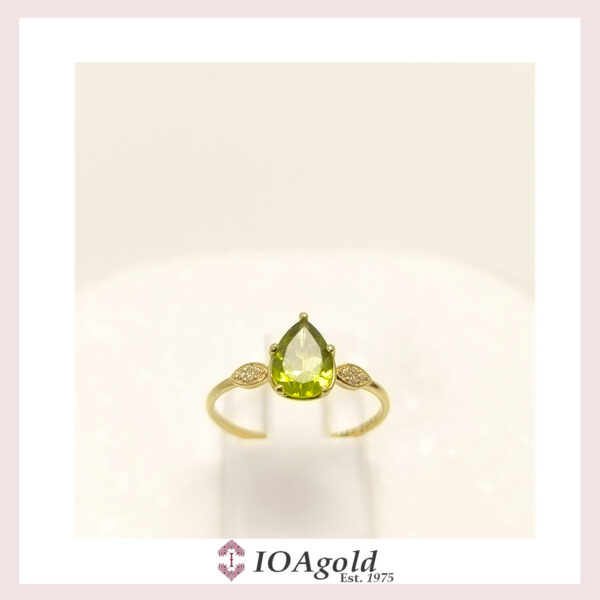 Gold ring 14k Peridot center and  zirconia stones