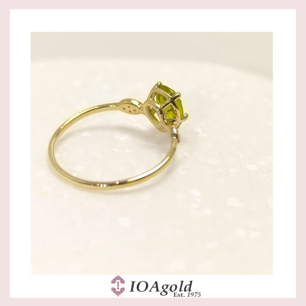 Gold ring 14k Peridot center and  zirconia stones