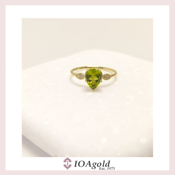 Gold ring 14k Peridot center and  zirconia stones
